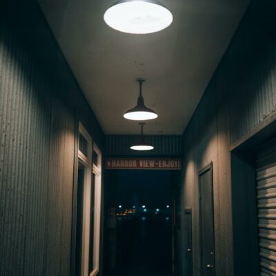 A hallway with two lights on it