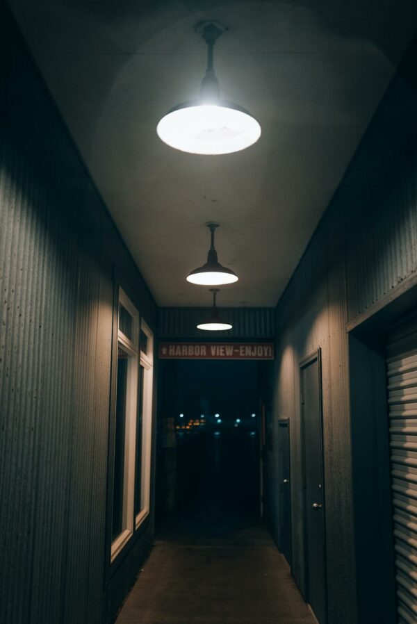 A hallway with two lights on it